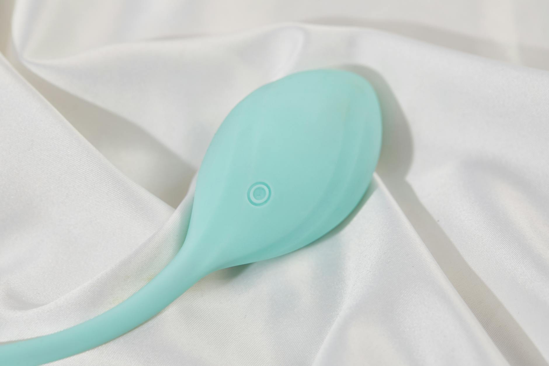 Vibrant collection of various sex toys on a black tray, featuring diverse shapes and colors